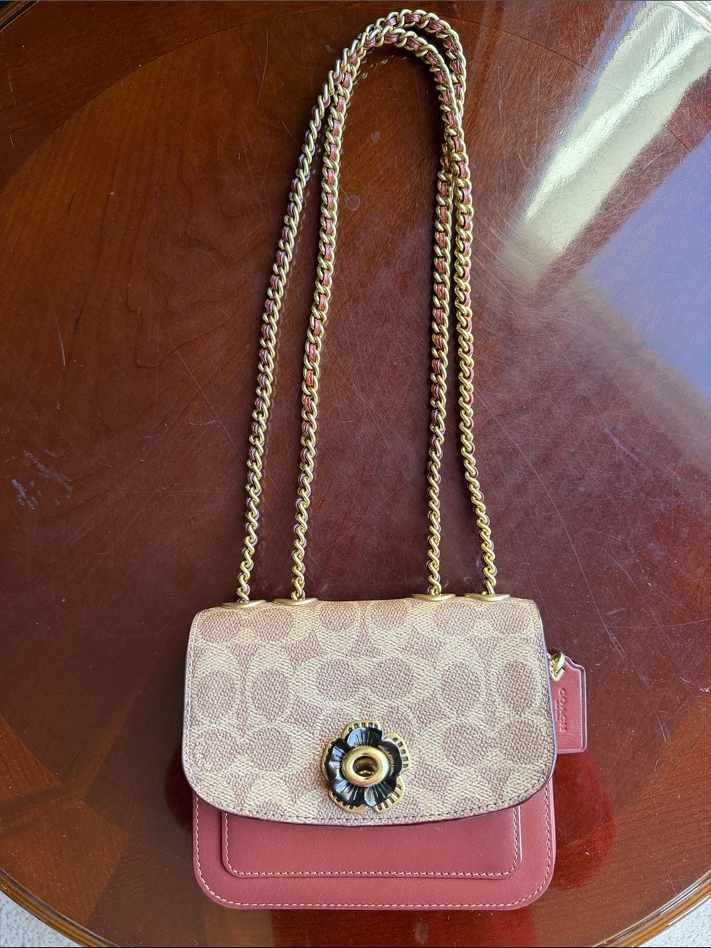 Coach Signature Floral Turnlock Crossbody in Brown and Tan